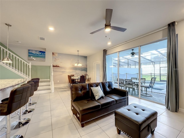 tiled living room featuring ceiling fan