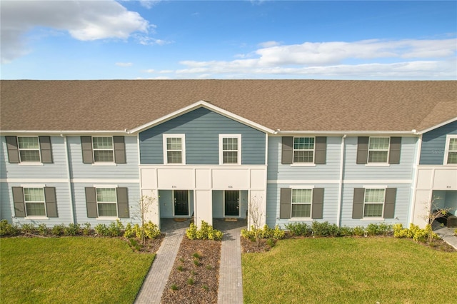 view of property with a front lawn