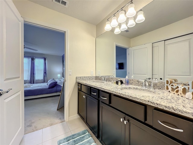 bathroom with tile patterned flooring and vanity