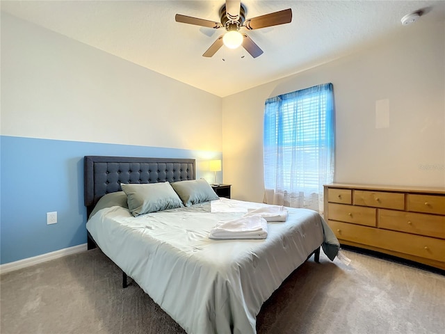 bedroom featuring light carpet and ceiling fan