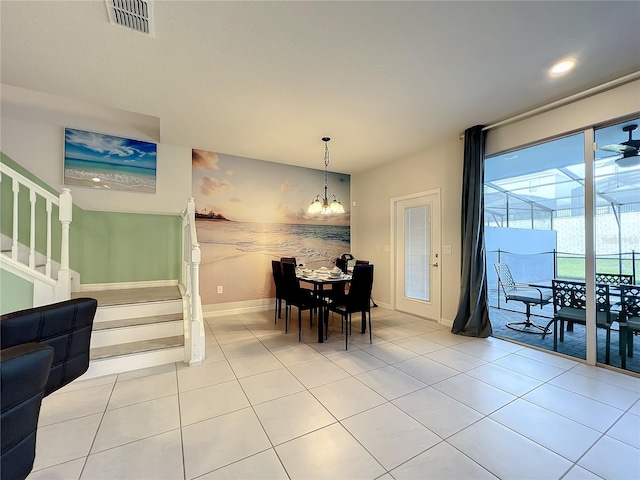 826 Paradise Dr, Davenport, FL 33897 - dining room with stairway, a chandelier, light tile patterned flooring, baseboards, and recessed lighting