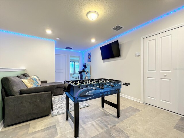 826 Paradise Dr, Davenport, FL 33897 - game room featuring baseboards