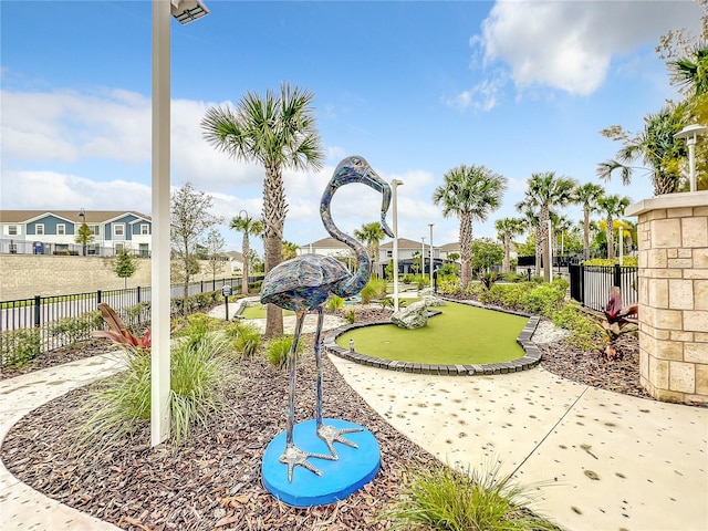 826 Paradise Dr, Davenport, FL 33897 - surrounding community featuring an area to practice putting and a residential view