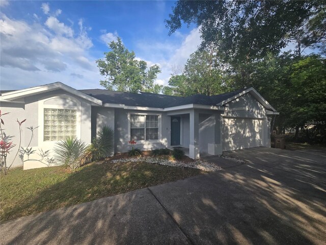 713 Swan Way, Kissimmee, FL 34758 - single story home featuring stucco siding, an attached garage, and concrete driveway