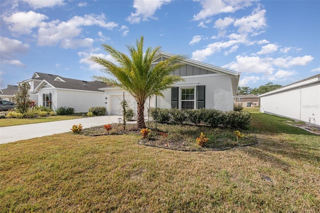 view of front of house with a front yard and a garage