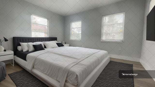 bedroom featuring multiple windows and tile walls