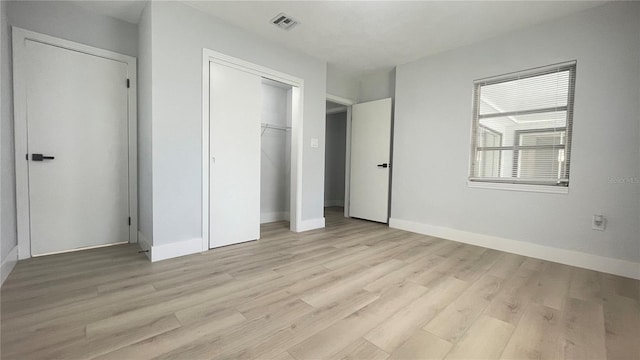 unfurnished bedroom with light hardwood / wood-style flooring