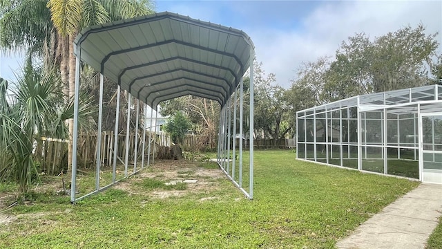 view of parking / parking lot featuring a lawn and a carport