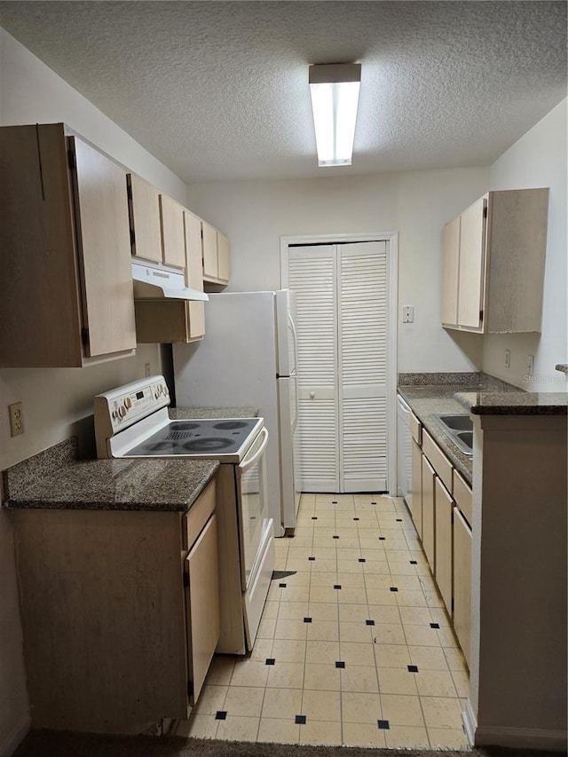 kitchen with electric range, light tile patterned flooring, and a textured ceiling