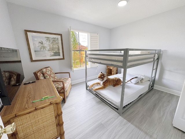 bedroom with wood-type flooring