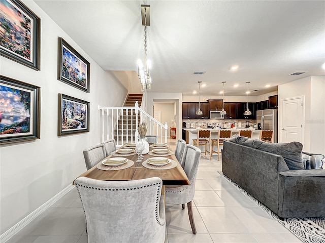 dining space featuring light tile patterned floors