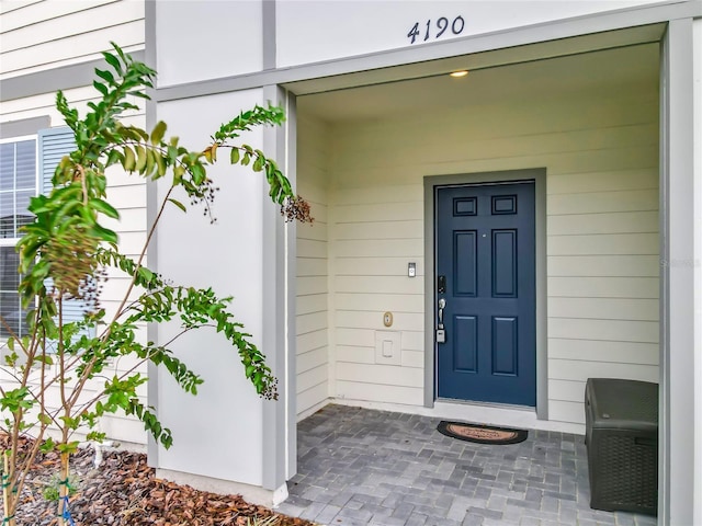 entrance to property with covered porch