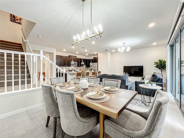 dining space featuring track lighting, an inviting chandelier, and light tile patterned flooring