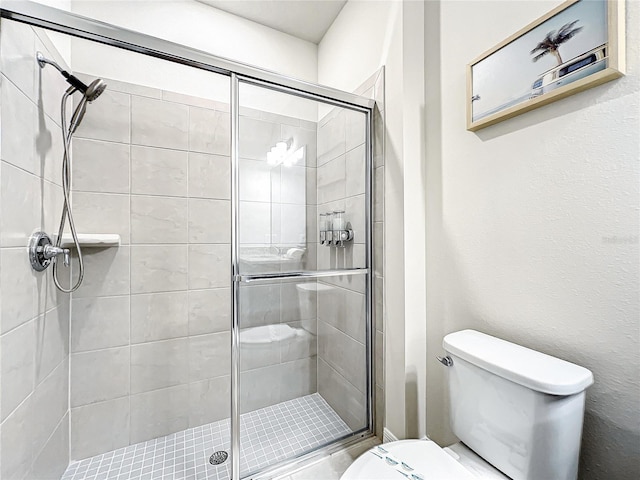 bathroom with toilet and walk in shower