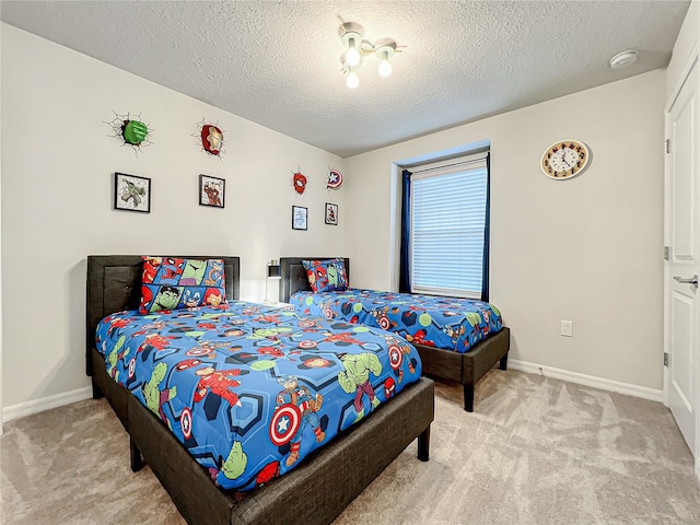 carpeted bedroom with a textured ceiling