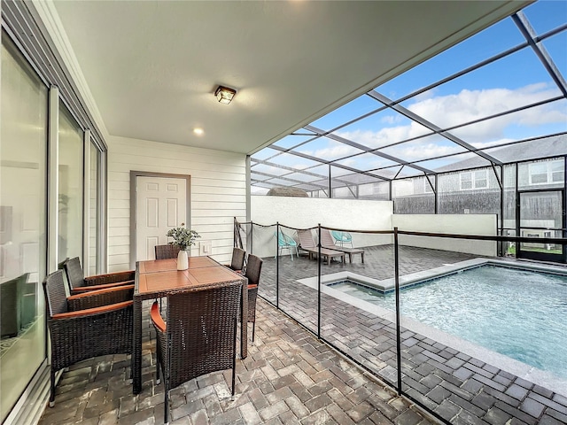 exterior space with a lanai and a patio