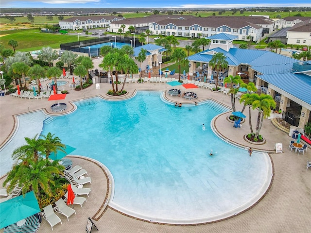 4190 Lana Ave, Davenport, FL 33897 - community pool with a patio area and a residential view
