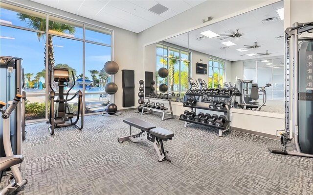 4190 Lana Ave, Davenport, FL 33897 - gym featuring a ceiling fan and carpet flooring
