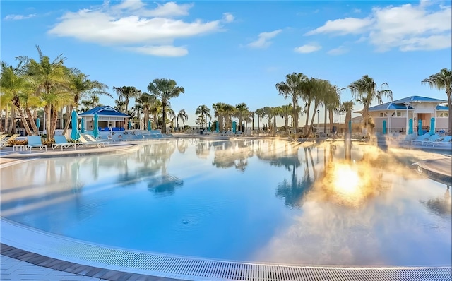 view of swimming pool with a water view