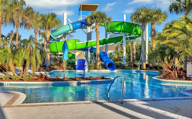 view of pool with a water slide