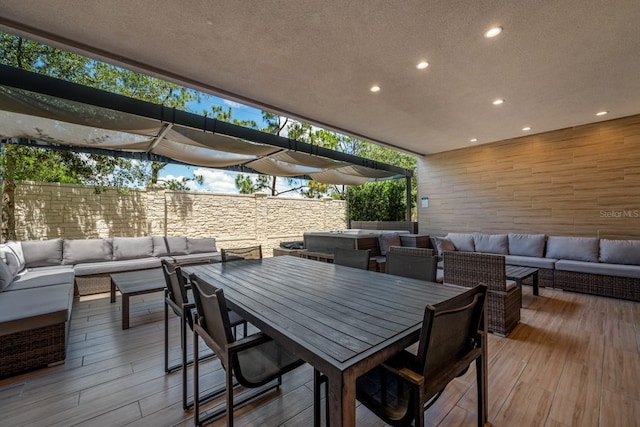 wooden deck featuring outdoor lounge area