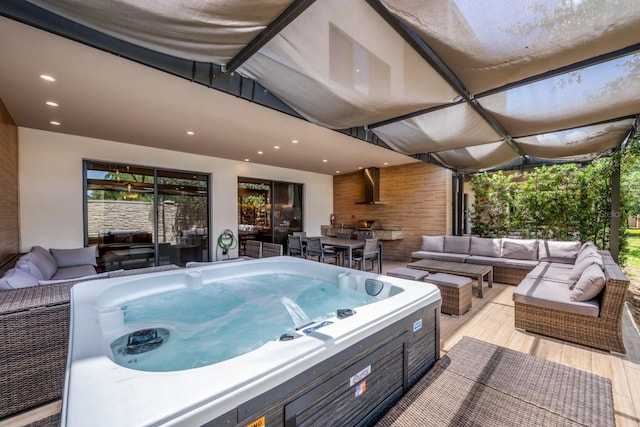 view of patio featuring an outdoor living space, a wooden deck, and a hot tub