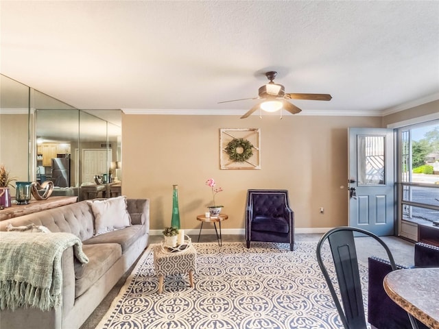 living room featuring a textured ceiling, ceiling fan, and crown molding