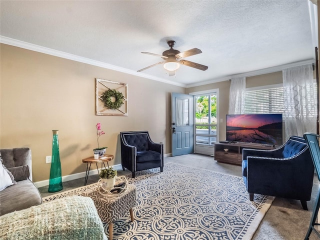 living room featuring ceiling fan, ornamental molding, and a textured ceiling