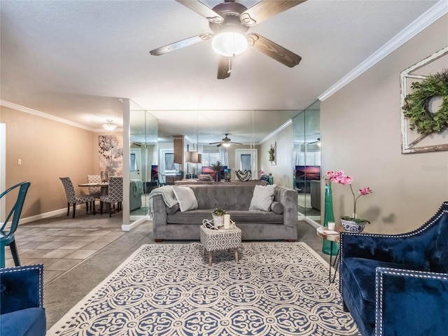 living room featuring tile patterned floors, ceiling fan, and ornamental molding