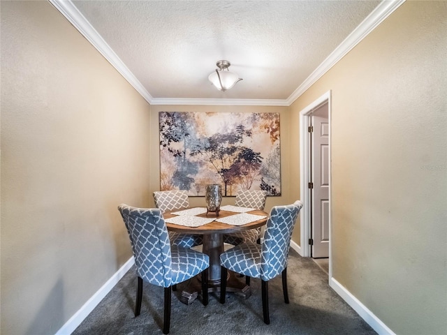 carpeted dining space with a textured ceiling and crown molding