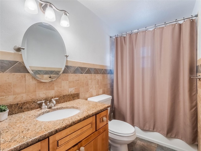 full bathroom featuring vanity, tile patterned floors, toilet, tile walls, and shower / tub combo with curtain