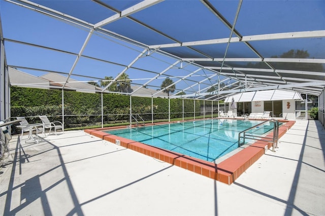 pool featuring a lanai and a patio area