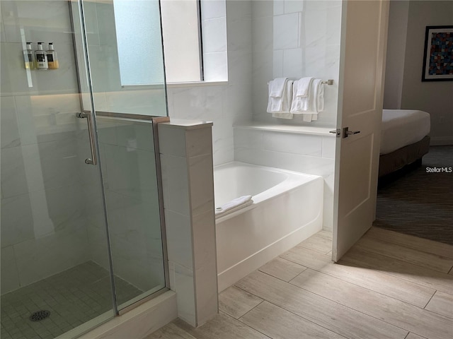 bathroom with independent shower and bath