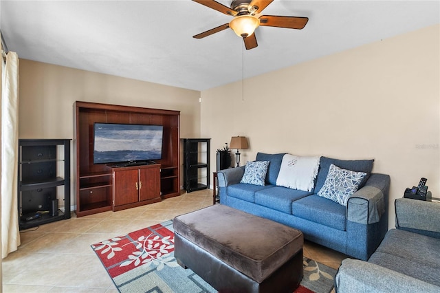 living room featuring ceiling fan and light tile patterned floors