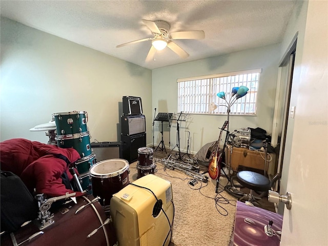 230 Cape Shores Cir Unit 17A, Cape Canaveral, FL 32920 - exercise room featuring a ceiling fan, carpet, and a textured ceiling