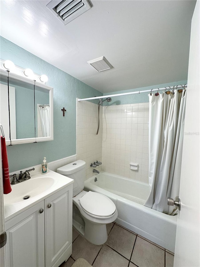 full bathroom with tile patterned flooring, vanity, toilet, and shower / bath combo with shower curtain