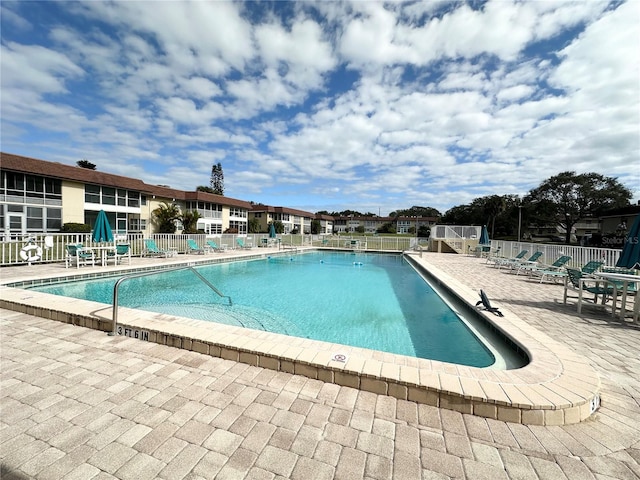 view of swimming pool with a patio