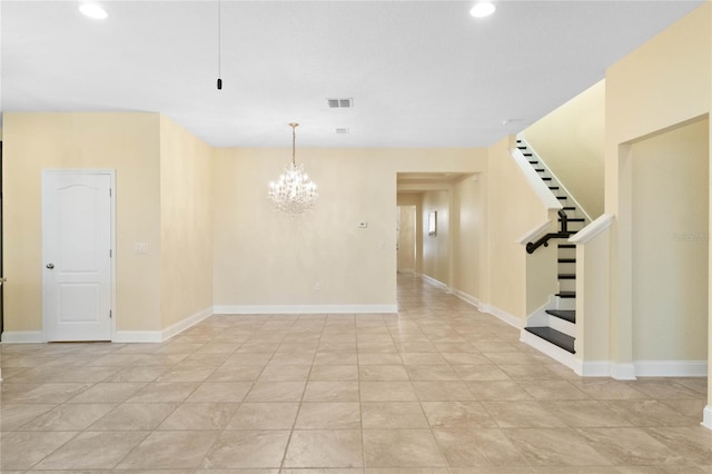 unfurnished room with light tile patterned floors and an inviting chandelier