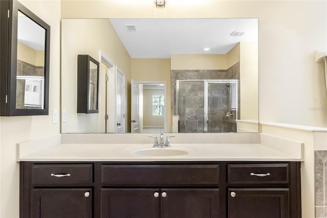 bathroom featuring vanity and walk in shower