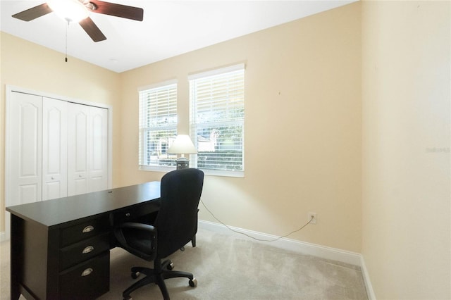 home office with ceiling fan and light colored carpet