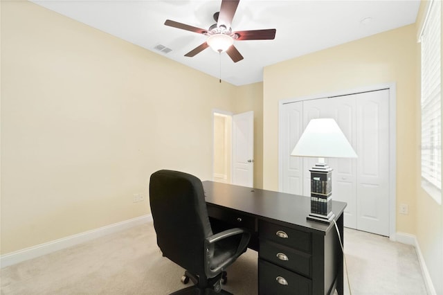 carpeted office with ceiling fan