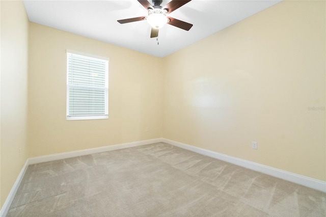 empty room with light carpet and ceiling fan