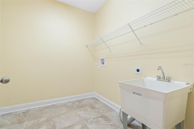 clothes washing area featuring hookup for an electric dryer, washer hookup, and sink