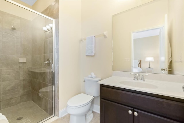 bathroom featuring tile patterned flooring, vanity, an enclosed shower, and toilet