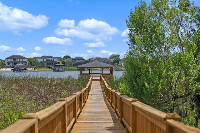 dock area featuring a gazebo and a water view