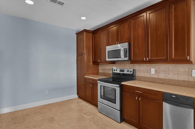 kitchen featuring decorative backsplash and stainless steel appliances