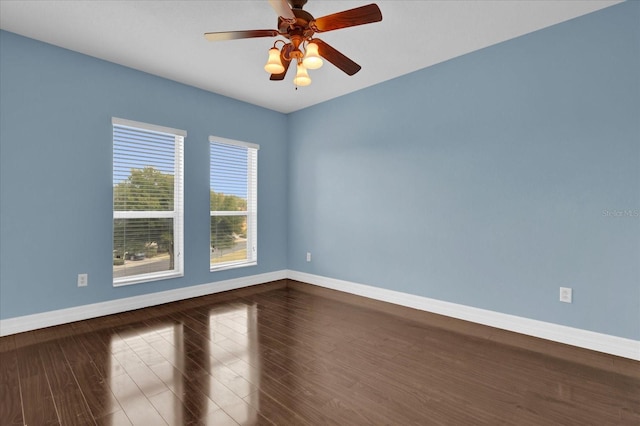 empty room featuring ceiling fan and hardwood / wood-style flooring