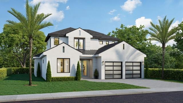 view of front of home with a garage and a front yard