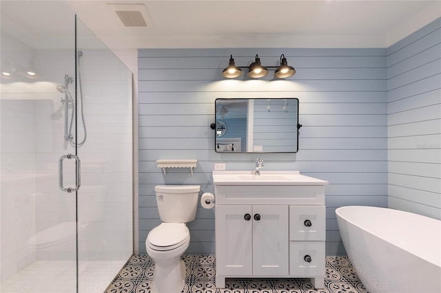 2260 Mulbry Dr, Winter Park, FL 32789 - full bathroom with a soaking tub, vanity, a shower stall, tile patterned floors, and toilet