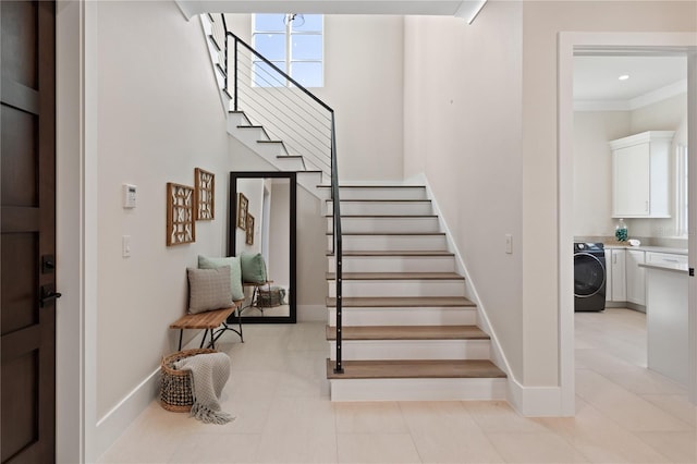 2260 Mulbry Dr, Winter Park, FL 32789 - stairway with washer / clothes dryer, baseboards, and tile patterned flooring